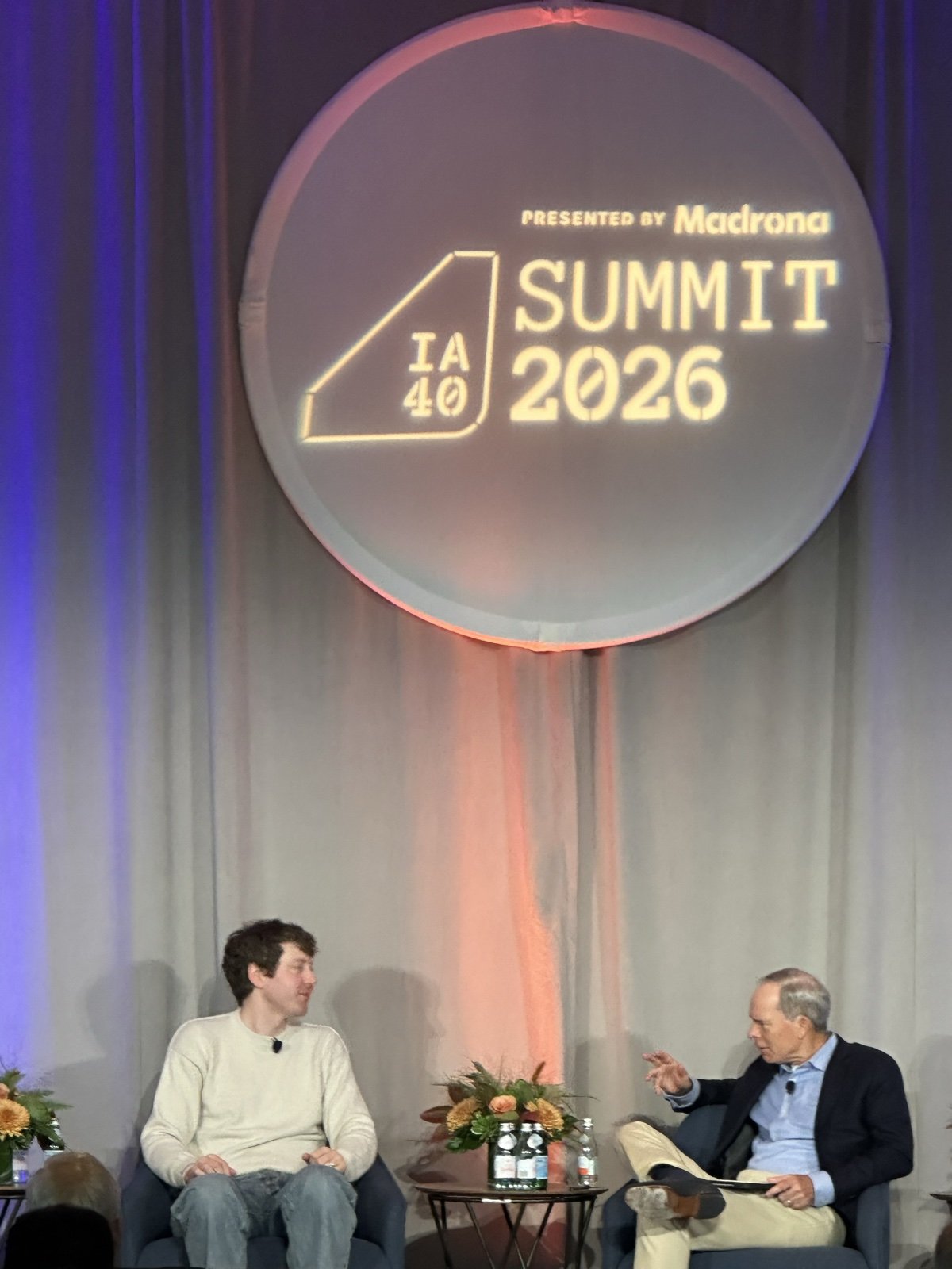 IA40 Summit 2026 logo projected on the floor