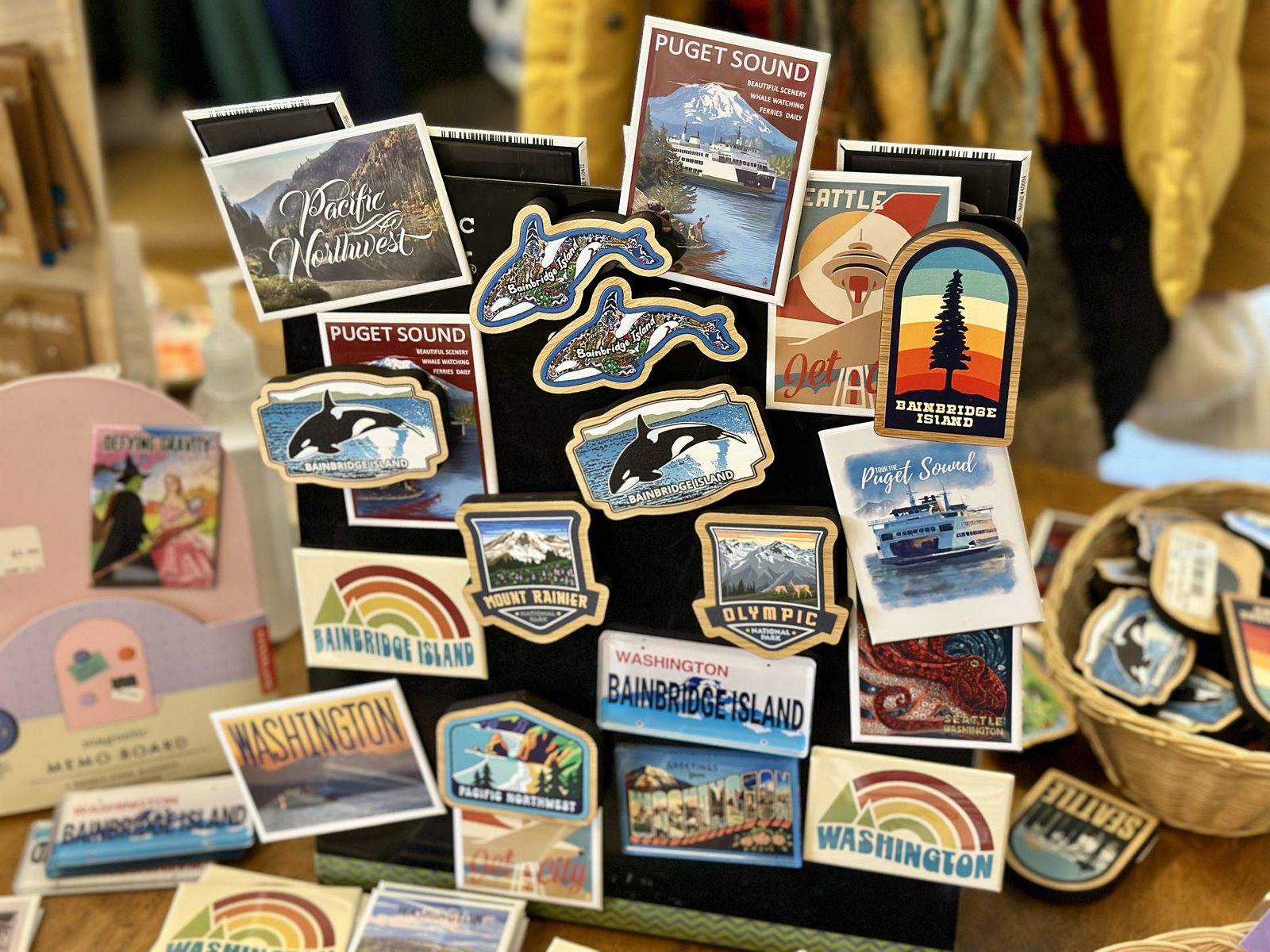 Bainbridge Island magnets and postcards on a gift-shop rack