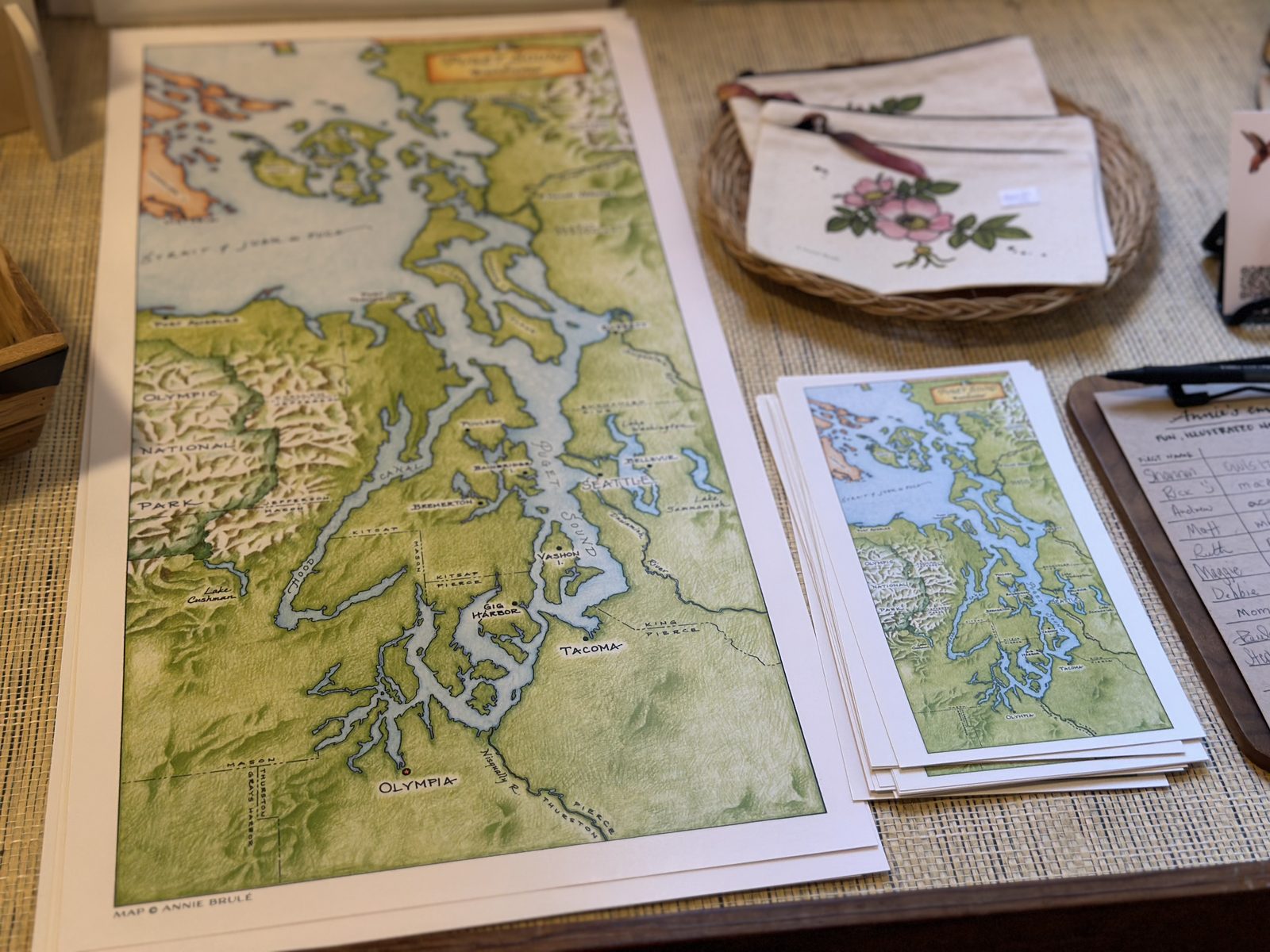 A hand-illustrated map of Puget Sound on a shop counter
